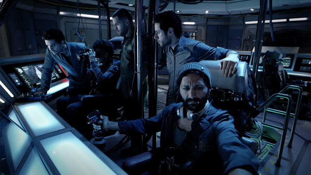 Crew gathered around the Rocinante system console<br />The Expanse © Copyright Syfy/Amazon